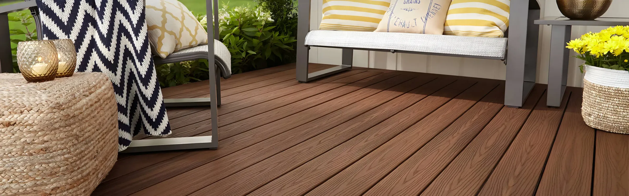 Fiberon Good Life composite decking installed in a warm brown outdoor seating area