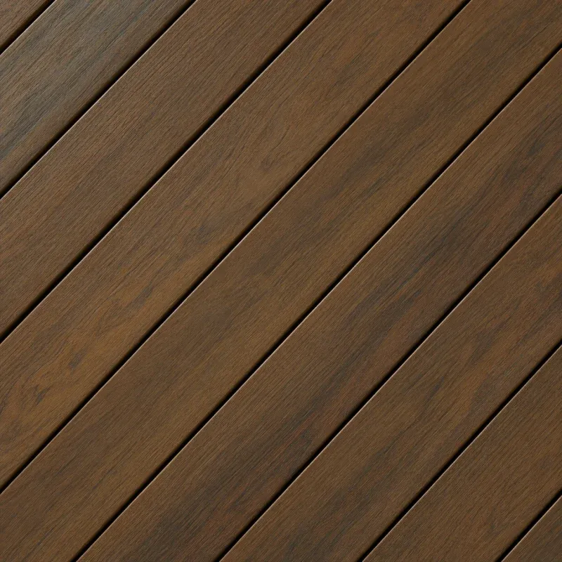 Close-up of hardwood deck boards laid diagonally.