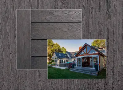 TruNorth Enviroboard decking in Ash Grey — board close-up beside a finished deck